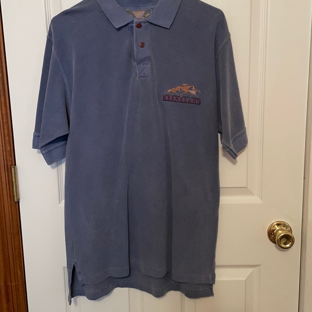 Men’s polo style shirt. Never worn. Slate blue.